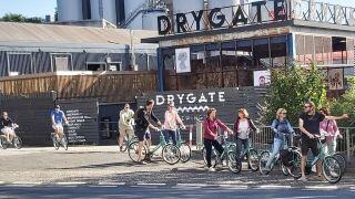 cyclists in front of drygate brewing co about to leave on bike tour