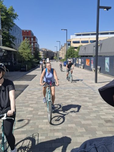 tourists cycling near Glasgow university on a bike tour