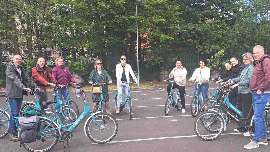 group of cyclists waiting in Drygate car park before bike tour of Glasgow