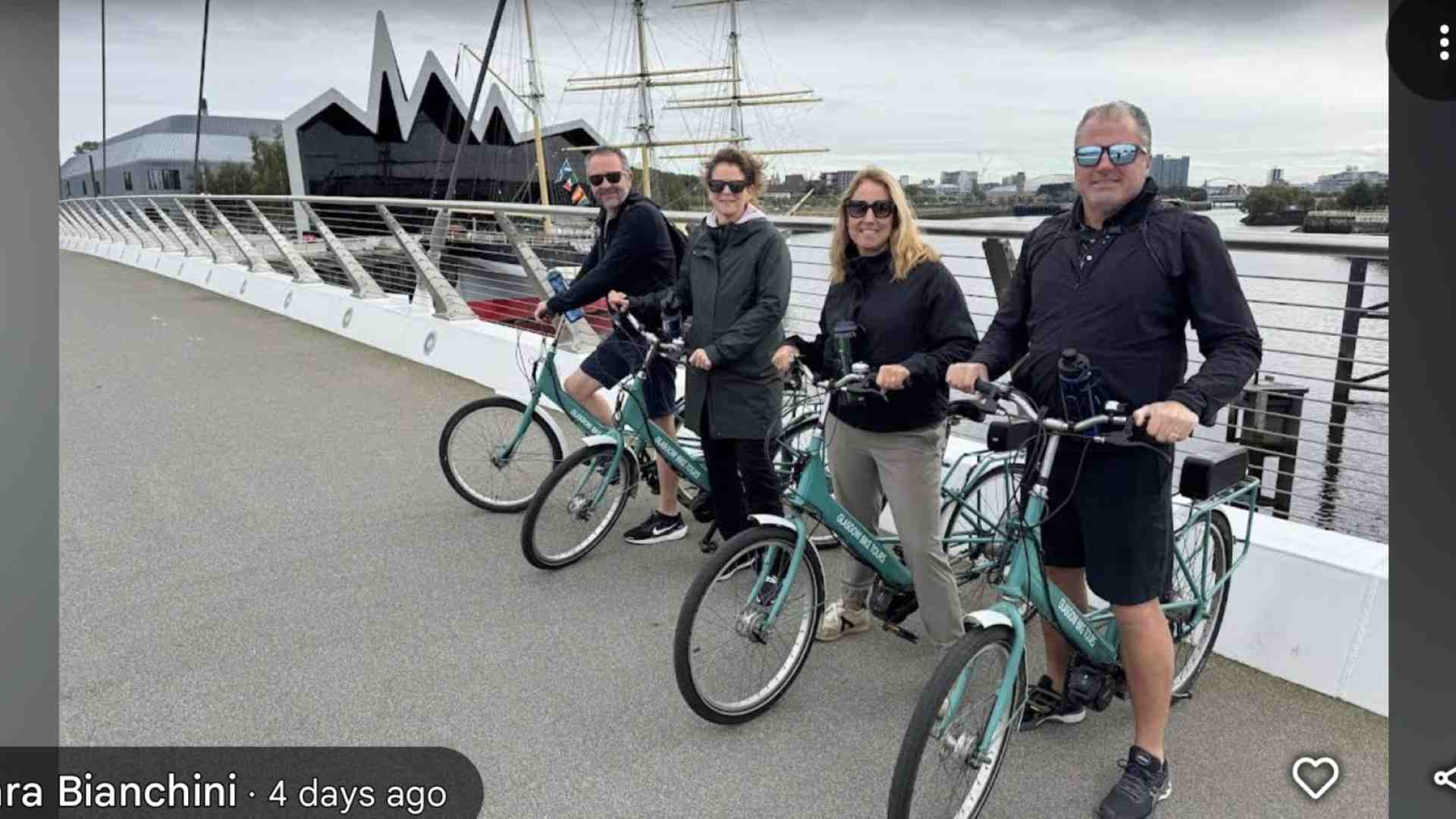 ebikes and riders at the riverside museum Glasgow next the tall ship